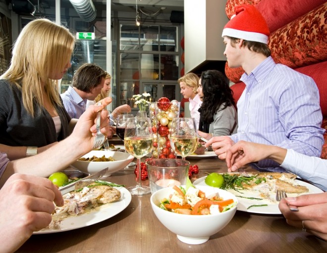 Group of friends enjoying their christmas dinner in a restaurant